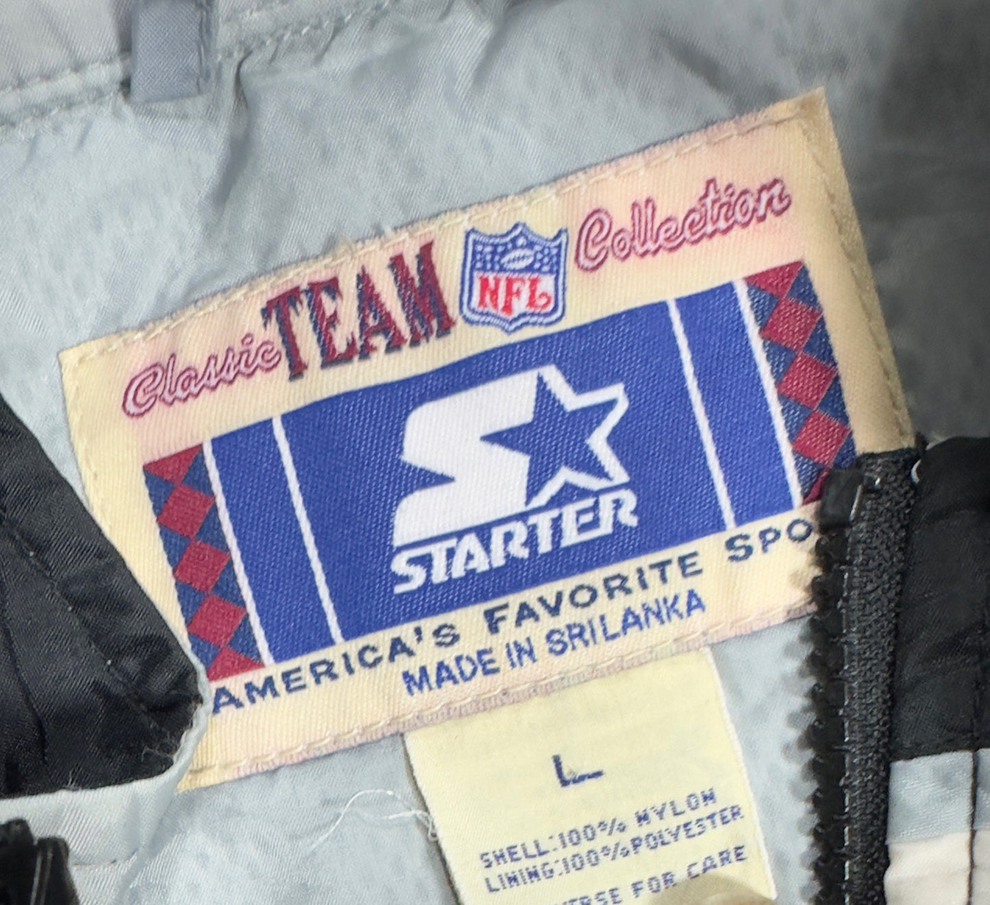 Oakland Raiders Starter Windbreaker